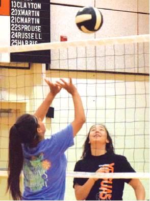THESE TWO VOLLEYBALL players participated in a drill at the Somerville Volleyball Camps. -- Tribune photo by Denise Hornaday