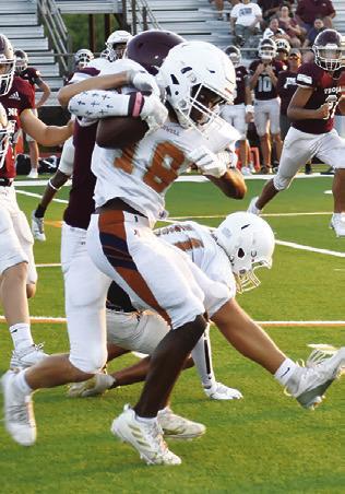 THE HORNETS Dejuan Mathis carries the ball against Troy. Caldwell opens the season this Friday at Crockett.