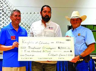 THE CALDWELL KNIGHTSOFCOLUMBUS (KC) presented a check to Bluebonnet Crimestoppers during the annual KC Law Enforcement Dinner. Pictured from left: Tony Zaccagnino, District Deputy, Steven Pipkin, Grand Knight and Chief Deputy Bill Rios, Burleson County Sheriff’s Office. Tribune photo by Sabine Lazo