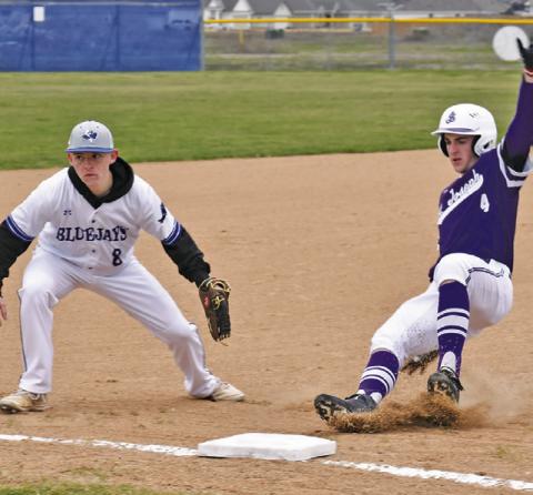 WYATT LOPEZ OF SNOOK is a third base as this St. Joseph baserunner approaches. Tribune photo by Roy Sanders
