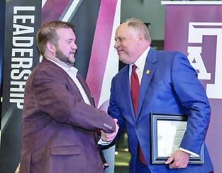 CLUB FOUNDER and President, Trey Groce, left, accepts Burleson County A&amp;M Club’s Charter from Porter S. Garner, Association of Former Students President, at the 2024 Fall Leadership Reception on Friday, November 15. Photo courtesy of The Association of Former Students