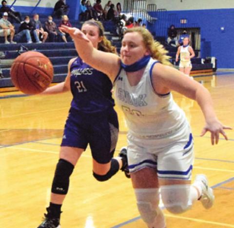 SHELBY HUDDLESTON reaches to keep the ball in bounds during the Lady Jays’ game against Douglass last Friday night.