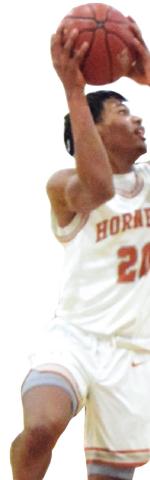 CALDWELL’S DEAUTRE Burns takes a jump shot during the Hornets’ loss to Academy last Wednesday. -- Tribune photo by Denise Squier