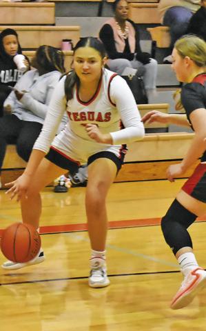 VIVIANNA MUNOZ dribbles down the court during the Somerville-Burton game. Tribune photo by Roy Sanders