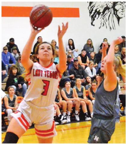 MADDIE COOPER shoots a layup during Somerville’s 76-29 home win over Normangee Friday night. -- Tribune photo by Roy Sanders