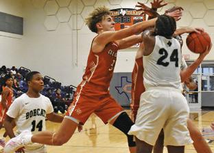 DYLAN CHAPMAN OF Caldwell fights for the ball against Hempstead. Tribune photo by Roy Sanders