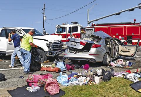THE VEHICLES FROM THE accident scene are in the southbound lane of SH 36 South. Tribune photo by Roy Sanders