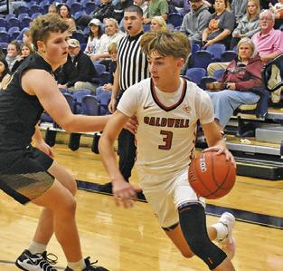 DYLAN CHAPMAN of Caldwell dribbles the ball past this Giddings defender. Tribune photo by Roy Sanders