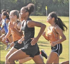 SOMERVILLE’S RAMAYA Carter runs with Caldwell’s Zoe Zwernemann and Jackie Gutierrez during the Caldwell Cross Country Invitational on Saturday morning.