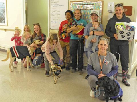 LOCAL RESIDENTS AND MEMBERS of Haven Animal Rescue of Texas (HART) brought dressed up dogs for a “Dog Parade” at Burleson Manor last Thursday afternoon. Tribune photo by Denise Squier