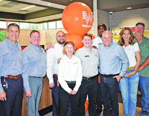 ED NELSON, NATIONAL CEO and president of Whataburger, visits the Whataburger on Wednesday, May 1, in Caldwell. Pictured from left are Jeff North, company brand leader, Tim Fisher, vice president of operations, Zach Udall, marketing leader, Doris Broaddus, employee, Justus Lumpkins, operating partner, Gary Harrison, manager, Nelson, and Bruce and Cindy Alford of Caldwell. -- Tribune photo by Roy Sanders