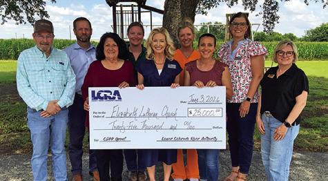 MEMBERS OF THE ELIZABETH Lutheran Church in Caldwell’s playground committee and LCRA gather to celebrate the $25,000 community grant. Photo courtesy of LCRA