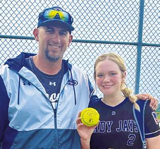 SNOOK PITCHER Aubrey Becker earned her 400th career strikeout last Tuesday against Iola. She is pictured with Snook Coach Dylan Conway.