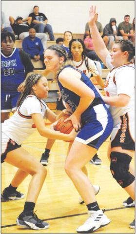SNOOK’S ALEXIS MACIK AND Somerville’s Gabby Jackson fight for possession of the ball during the Snook-Somerville game last Friday night.