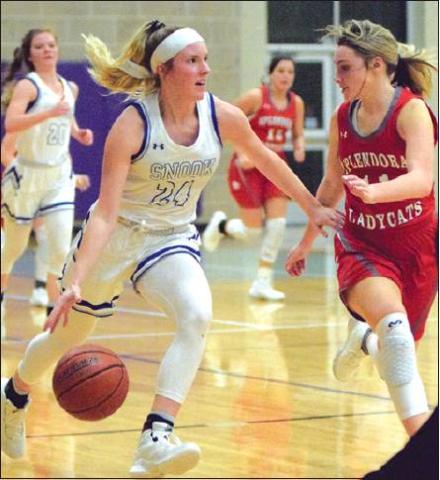 SNOOK’S JAYCIE BRISCO drives the ball down the court after a rebound during the Lady Jays’ win over Splendora Thursday night during the Aggieland Invitational. -- Tribune photo by Denise Hornaday