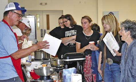 BRUNO SHIMEK addresses the gathering at the Kolache making demonstration on Friday at Caldwell Methodist Church.