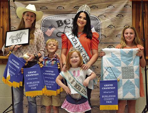 IVY AND RORY CHATWIN won grand in Adult Art, Bloopers, Creative Arts and Crafts, Canned Food and Photography as well as Children’s Corner Art and Horticulture. Emersyn McAllister won grand in Intermediate Quilts. Also pictured are Fair Queen Kodi Hitchcock and Little Miss Taytum Hohlt. Tribune photo by Sabine Lazo