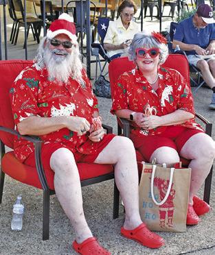 SANTA AND MRS. Claus greet the crowd on Wednesday, July 16, at Christmas in July celebration in downtown Caldwell.