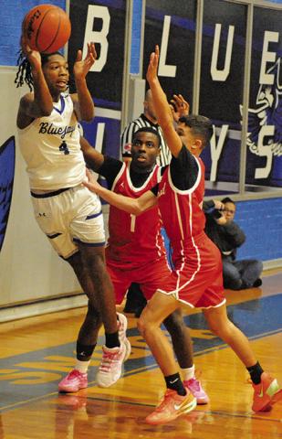 JOHN CARR OF Snook prepares to pass against Bremond. Tribune photo by Roy Sanders
