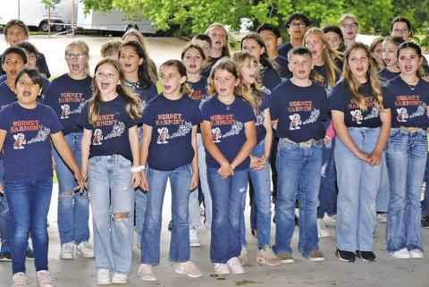 THE CALDWELL INTERMEDIATE School Choir sings with enthusiasm at the National Day of Prayer celebration on May 2 in Caldwell. The choir got strong ovation from the appreciative crowd.