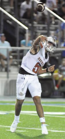 JOHN FRYREAR passes the ball against Robinson. Tribune photo by Denise Squier