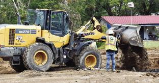 LARRY YOUNG PAVING of Bryan works on this drainage project on Harvey Street last Friday in Caldwell. Tribune photo by Roy Sanders