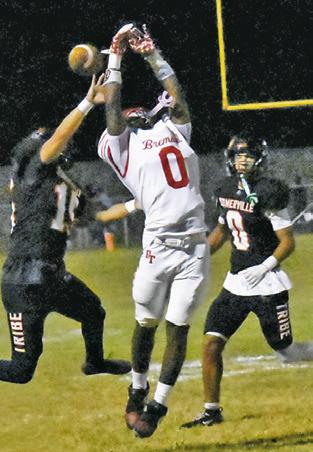 ULISSES PEREZ and Jaille Deere defend and break up this Bremond pass. Tribune photo by Roy Sanders