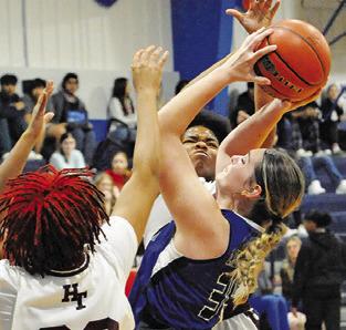 ALEXIS MACIK is triple-teamed by Hearne during the Snook Lady Jay Basketball Tournament. -- Tribune photo by Denise Squier