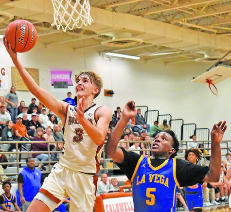 DYLAN CHAPMAN OF Caldwell takes a layup shot against LaVega in the Dec. 5 game in Caldwell. -- Tribune photo by Roy Sanders