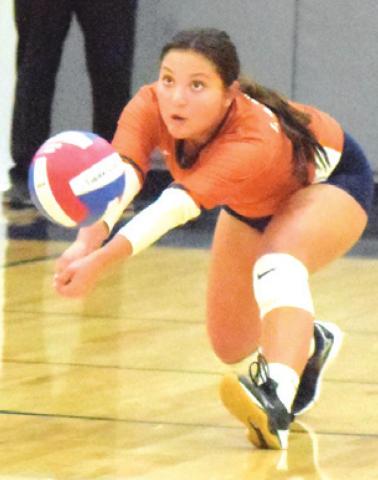 MACY NARRO returns a serve by a Madisonville player, bumping the ball to the Caldwell setter. -- Tribune photo by Denise Squier
