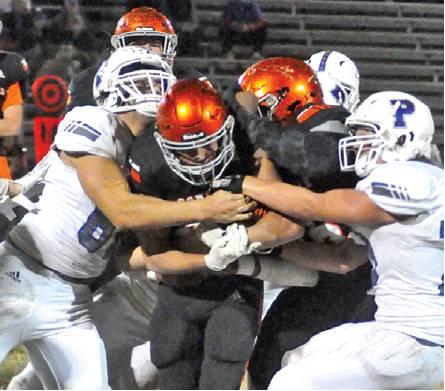 SOMERVILLE’S JEREMIAH TEAGUE fights for extra yardage against the Peaster defense last Friday in Somerville. The Yeguas lost their finale and finished 2-8. -- Tribune photo by Roy Sanders