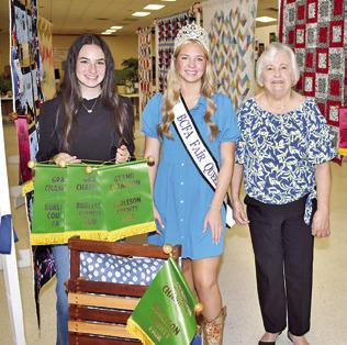 TANNA BOYKIN WON grand champion for a wood project and for photography, and Diane Gilbert won grand for a wall hanging. Burleson County Fair Queen Hadleigh Novosad is also pictured.