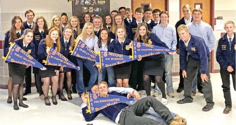 CALDWELL HIGH SCHOOL FFA students hold these banners after placing well at the District Leadership Event contests at A&amp;M Consolidated High School. They are advancing to the Area XII competition on Nov. 23 in Georgetown.