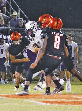 THE SOMERVILLE DEFENSE, including Keke Daniels and Ian Teague move in for a tackle against Thrall.