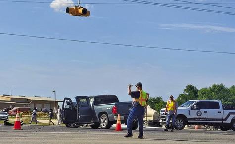 SNOOK VOLUNTEER FIREFIGHTERS and other emergency responders work the scene of this accident on Sunday afternoon off F.M. 60 and F.M. 50. Photo courtesy of Snook Volunteer Fire Dept.