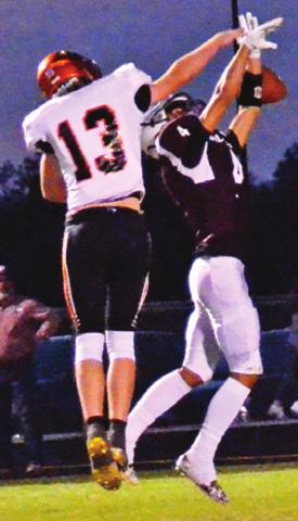 SOMERVILLE’S HUNTER David breaks up this Iola pass. -- Tribune photo by Roy Sanders
