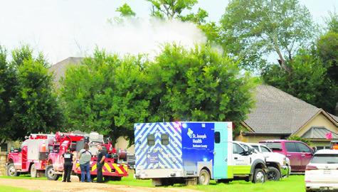 FIREFIGHTERS FROM CALDWELL and Deanville respond to this house fire on Thursday, July 18, on County Road 100.