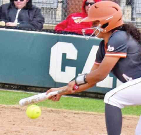 CALDWELL’S ALIYAH VELA bats during Caldwell-Bellville game at the annual SWARM Softball Tournament last Saturday.