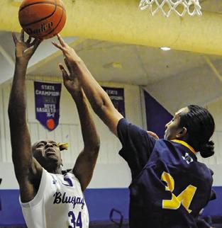 JEREMIAH POWELL of Snook shoots against Allen Academy. The Bluejays won 78-19. Tribune photo by Denise Squier