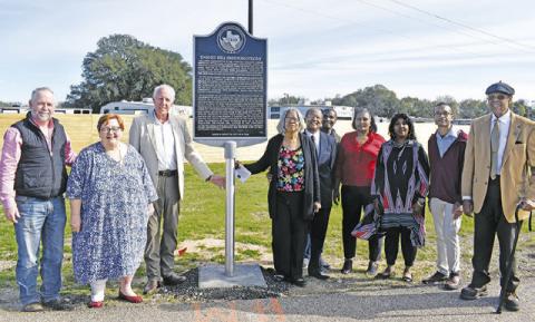 A HISTORICAL MARKER was unveiled in February 2023 for the Dabney Hill Freedom Colony. Burleson County Judge Keith Schroeder and Gloria Smith conduct the unveiling. Also pictured are Melynda Giesenschlag, Peggy Gaskamp Sanders, Sharon Prejean and Steve Tunnell. Both the church and the Ethiopian Star Lodge Masonic Hall No. 308 in Dabney Hill received grants to restore the buildings.