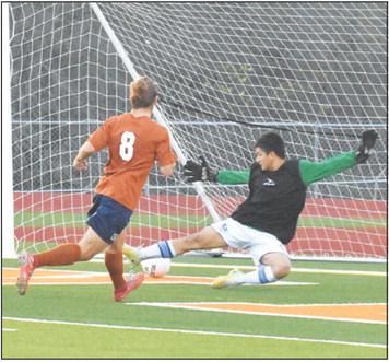 CALDWELL’S DAVID GOFF SCORES ONE of his four goals against Jarrell last Friday.
