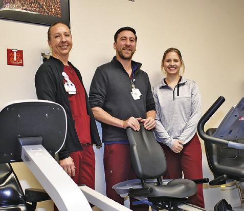 HOSPITAL STAFF MEMBERS are pictured in the cardiac rehab area. They include, from left, Anne Lockhart, Tim Reinberg and Tori Janak.