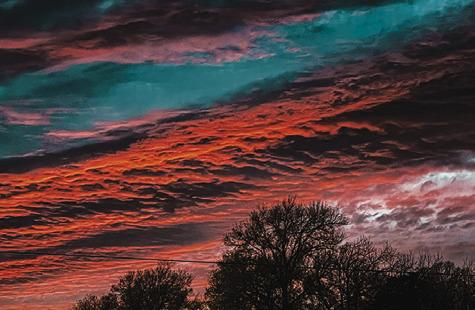 THIS BEAUTIFUL COLORFUL SKY WAS visible last Thursday, Jan. 30, during sunset over Burleson County. Tribune photo by Denise Squier