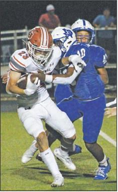 BRAXTON FRITCHER fights for extra yardage against Jarrell last Friday in Jarrell. -- Tribune photo by Kim Hutcheson