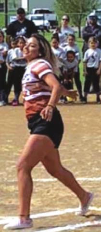 MERCEDE RODRIGUEZ, Lady Hornet pitcher, throws the first pitch during opening ceremonies for Caldwell Little League softball.