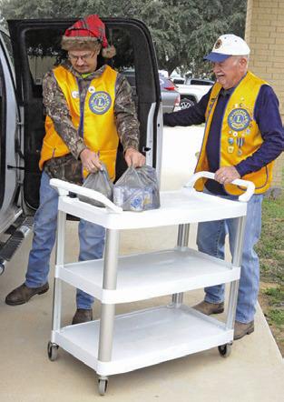 LAKE SOMERVILLE LIONS CLUB was among the many local groups to send volunteers for this year’s Food for Families food drive. Tribune photo by Denise Squier