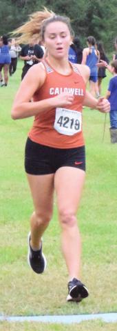 MORGAN BECKA crosses the finish line to place third in the girls’ varsity race at the District 19-3A Cross Country Meet.