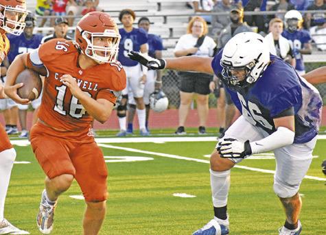 KEIFER ELLIS OF Caldwell carries the ball against Navasota in the Aug. 18 scrimmage. -- Tribune photo by Roy Sanders