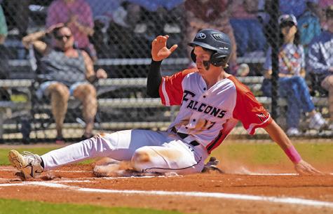 CALDWELL’S DANIEL BARDIN slides into home during the Northside Falcons-Springfield Chargers baseball game at the Homeschool World Series tournament in Auburndale, Florida.