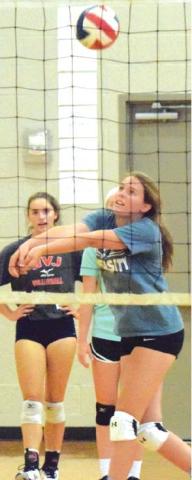 AROUND 30 AREA volleyball players attended a volleyball clinic at Snook ISD. Olympic gold medalist and World Champion volleyball player Patrick Powers led the clinic.